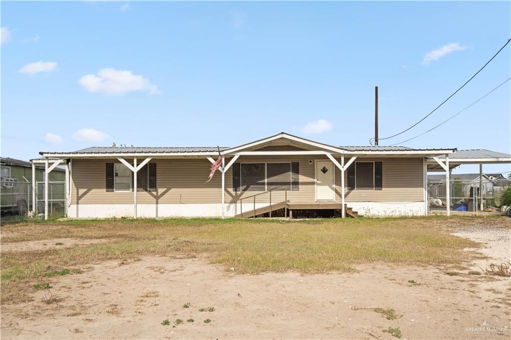 2209 Topacio Street Donna, TX 78537 - Photo 1 of 17 a front view of a house with a yard