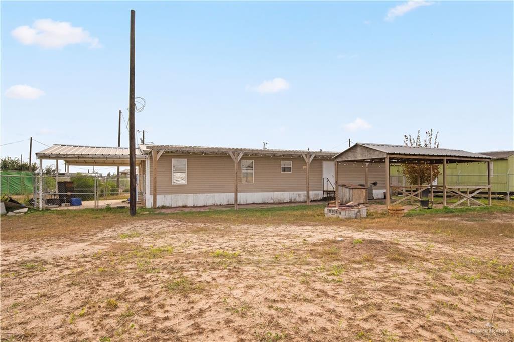 2209 Topacio Street Donna, TX 78537 - Photo 12 of 17 a view of a house with a yard