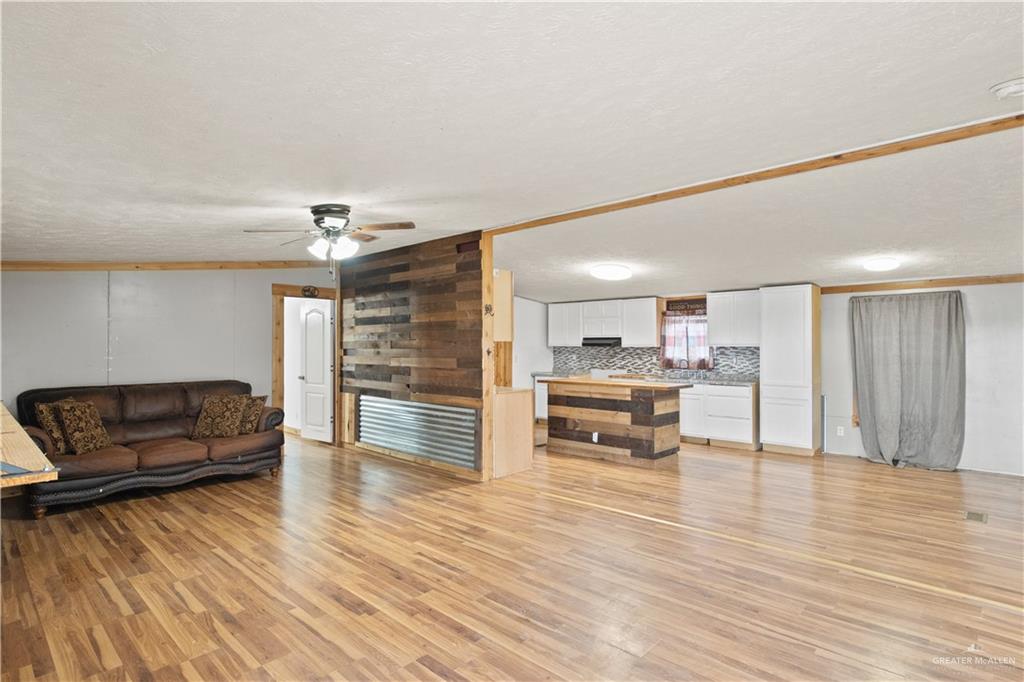 2209 Topacio Street Donna, TX 78537 - Photo 3 of 17 a living room with furniture and a wooden floor
