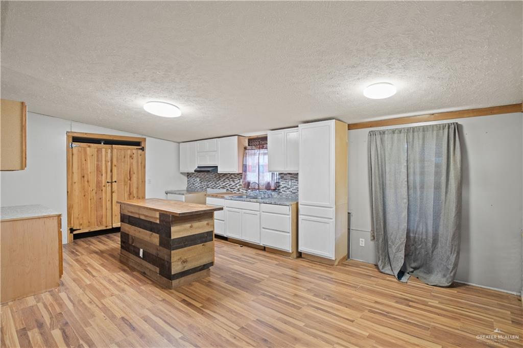 2209 Topacio Street Donna, TX 78537 - Photo 4 of 17 a room with a bed and a dresser