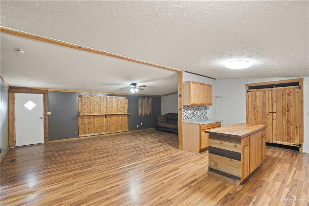 2209 Topacio Street Donna, TX 78537 - Photo 5 of 17 a view of empty room with wooden floor and window