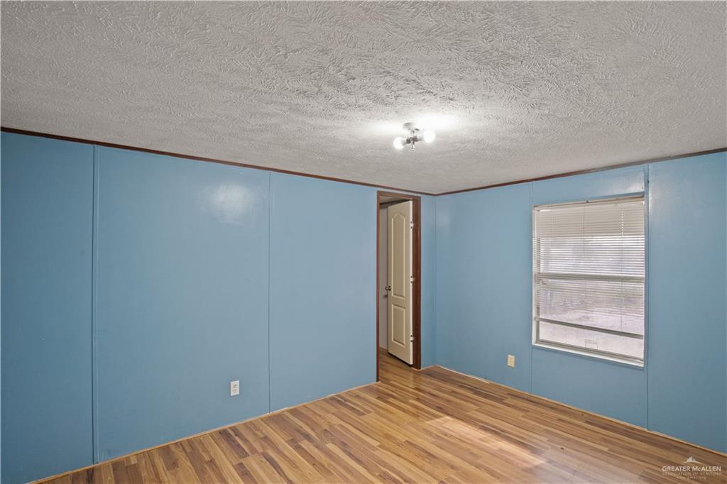 2209 Topacio Street Donna, TX 78537 - Photo 10 of 17 a view of room with window and ceiling fan