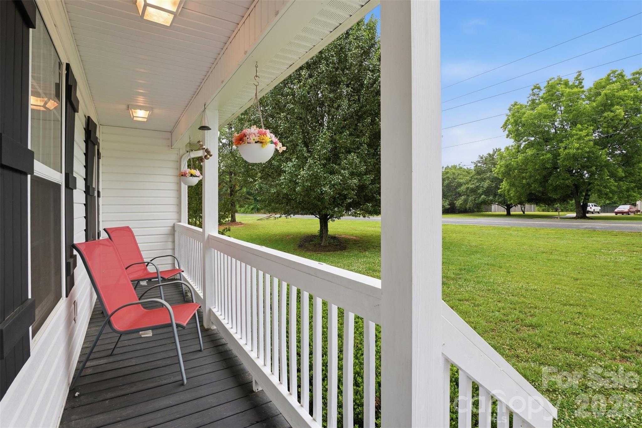 810 Tirzah Road York, SC 29745 - Photo 25 of 29 a balcony with chairs and a table