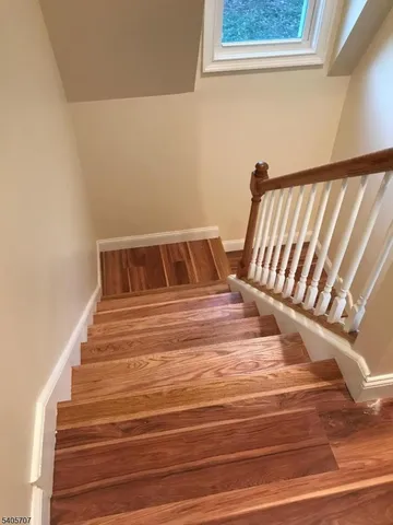 a bedroom with a bed and chair