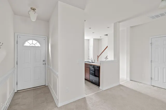 a kitchen with stainless steel appliances granite countertop a sink and dishwasher