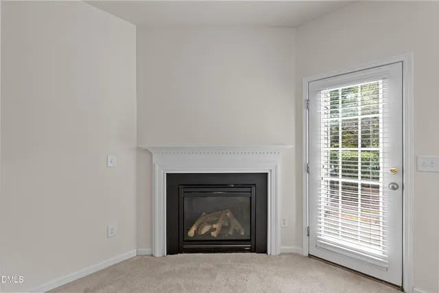a living room with a fireplace