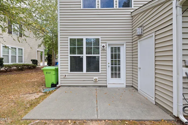 a view of a house with a yard and sitting space