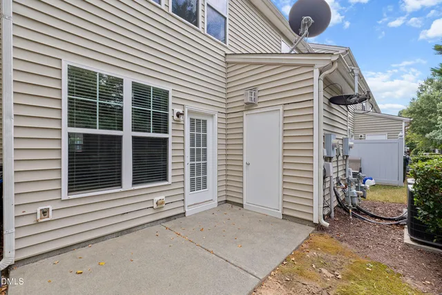a view of a garden with plants and a bench