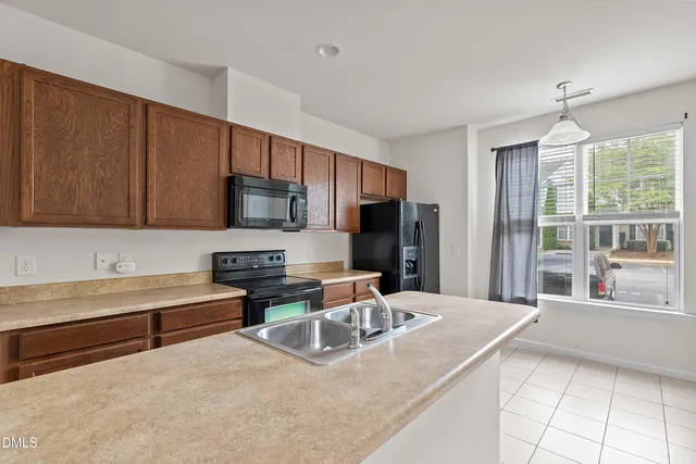 a bedroom with a large bed and a large window