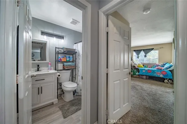a spacious bathroom with a double vanity sink and a mirror