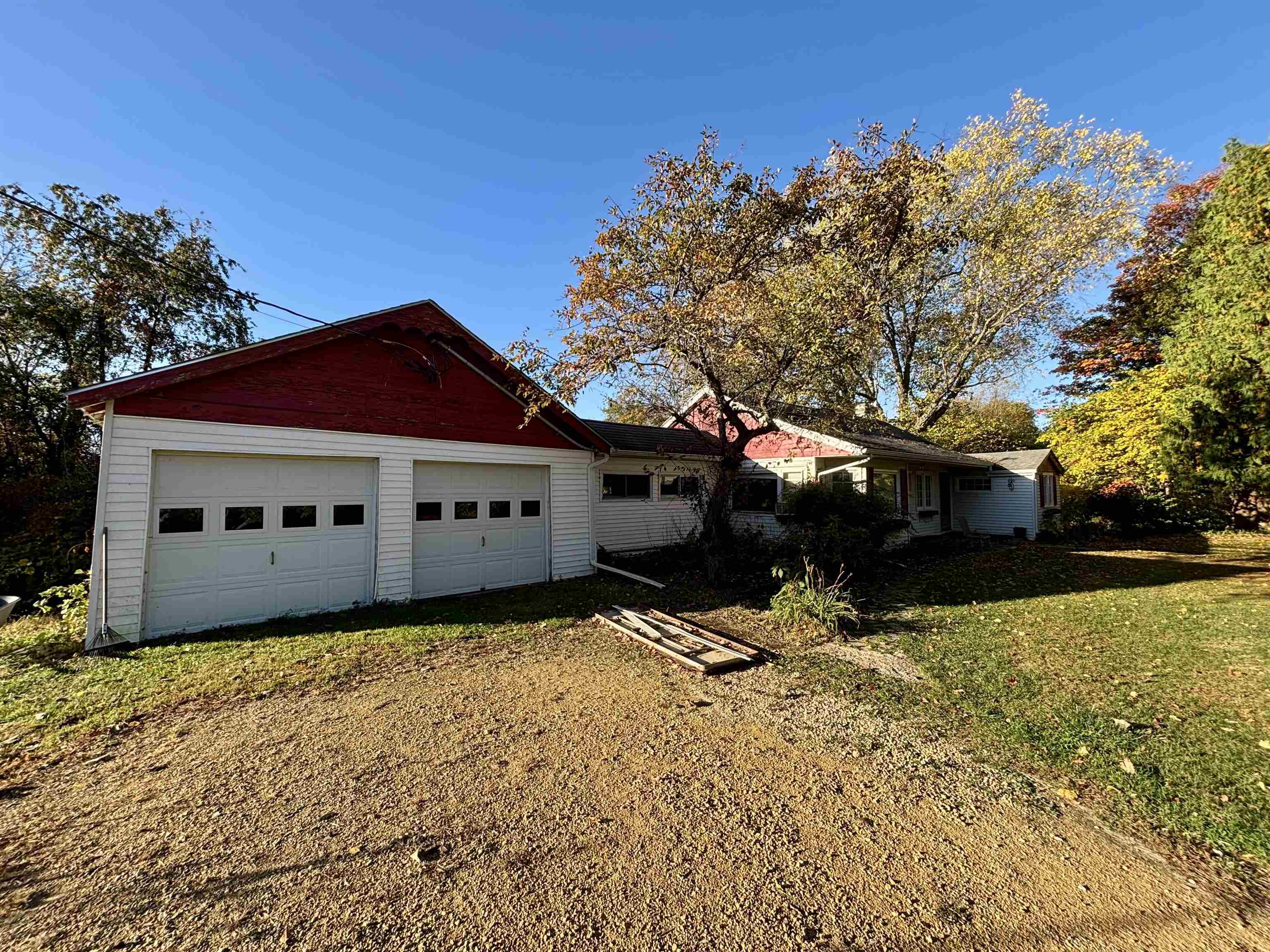 7151 West Blackjack Road Galena, IL 61036 - Photo 16 of 49 a front view of house with yard and trees in the background