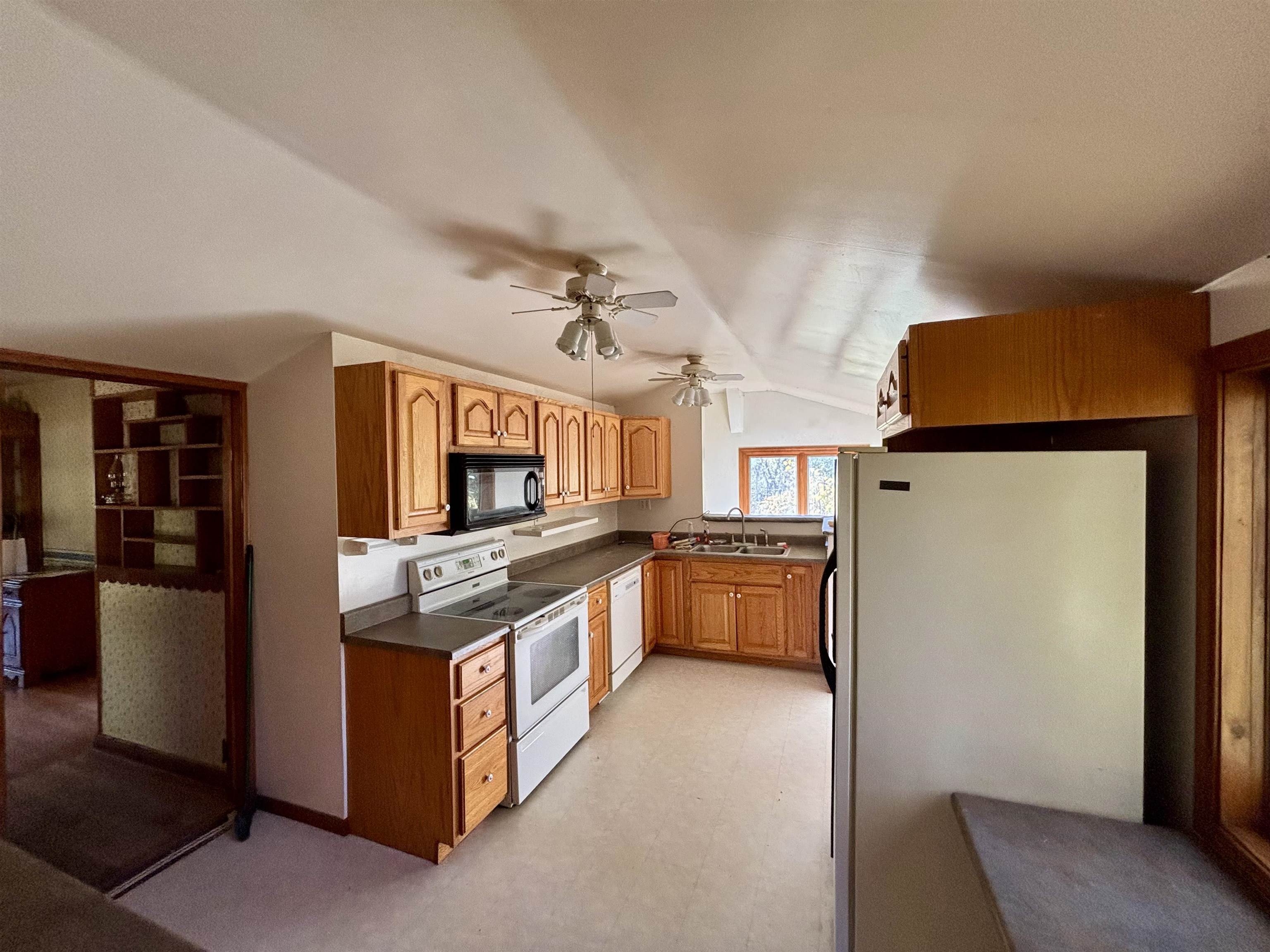 7151 West Blackjack Road Galena, IL 61036 - Photo 19 of 49 a kitchen with stainless steel appliances granite countertop a stove and a refrigerator