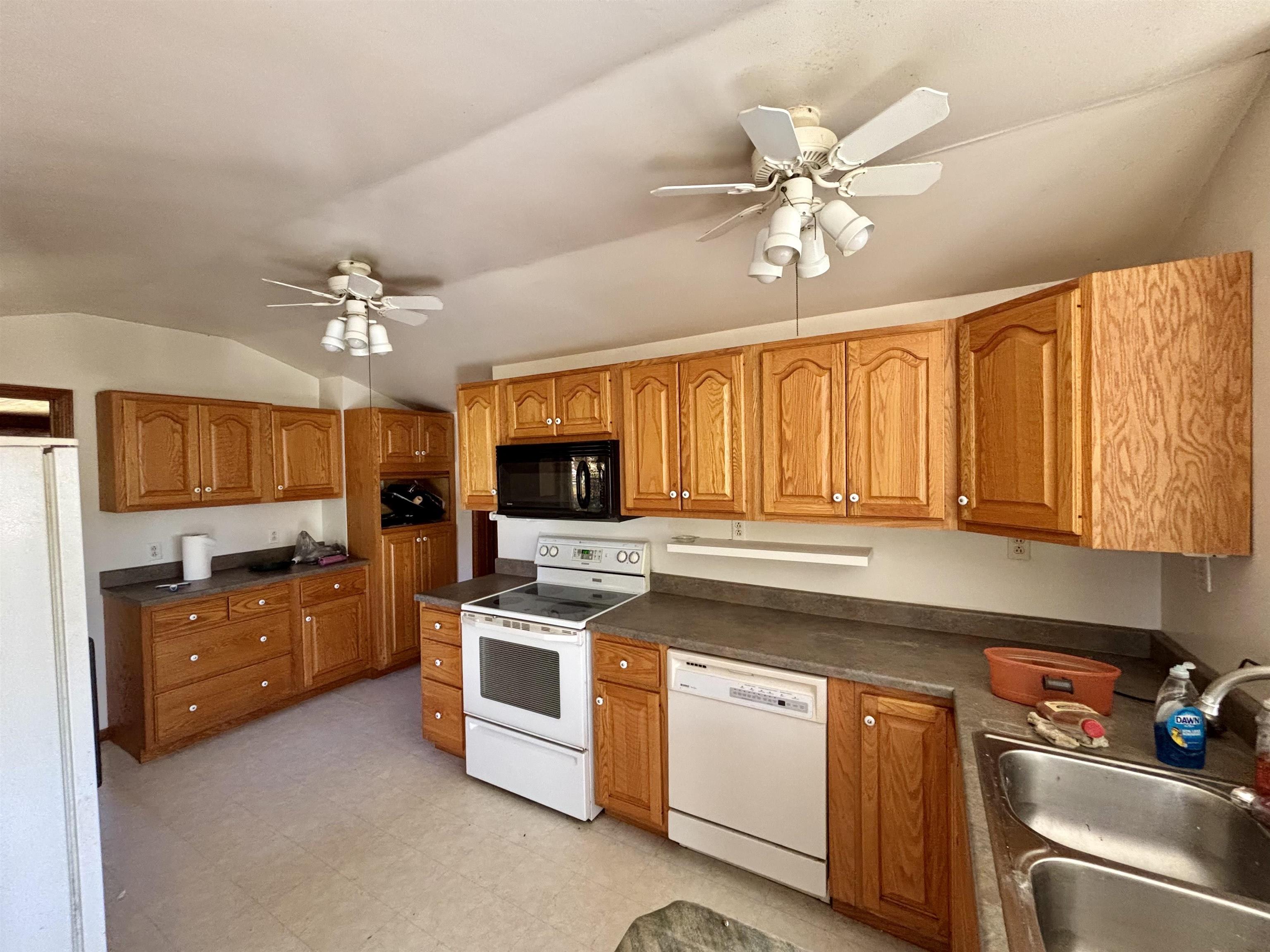 7151 West Blackjack Road Galena, IL 61036 - Photo 20 of 49 a kitchen with a stove a sink and a refrigerator