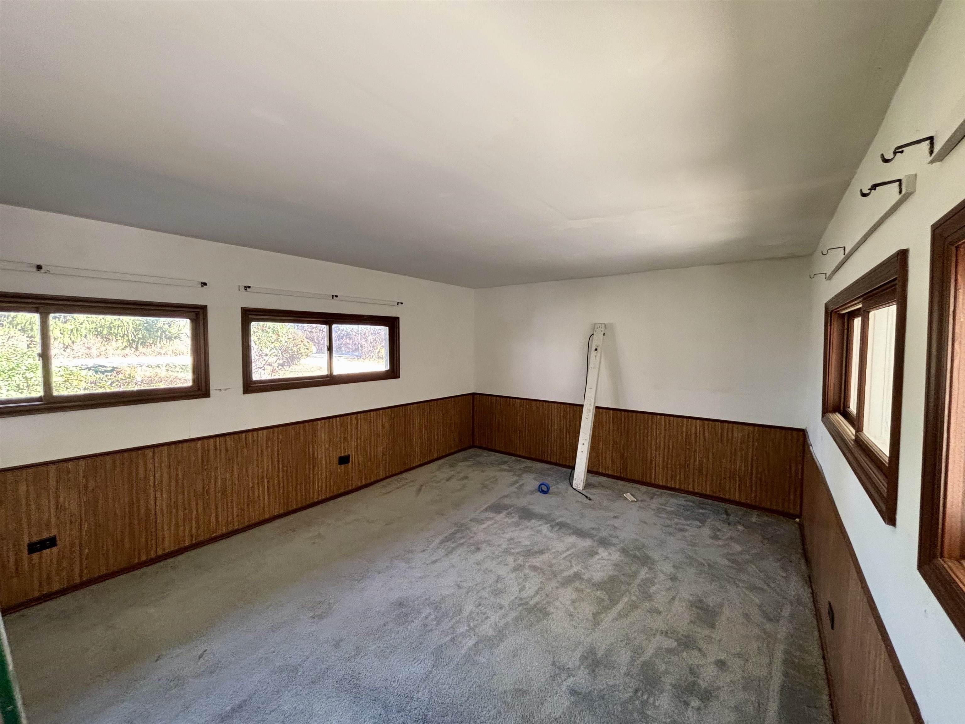 7151 West Blackjack Road Galena, IL 61036 - Photo 24 of 49 a view of an empty room with wooden floor and windows