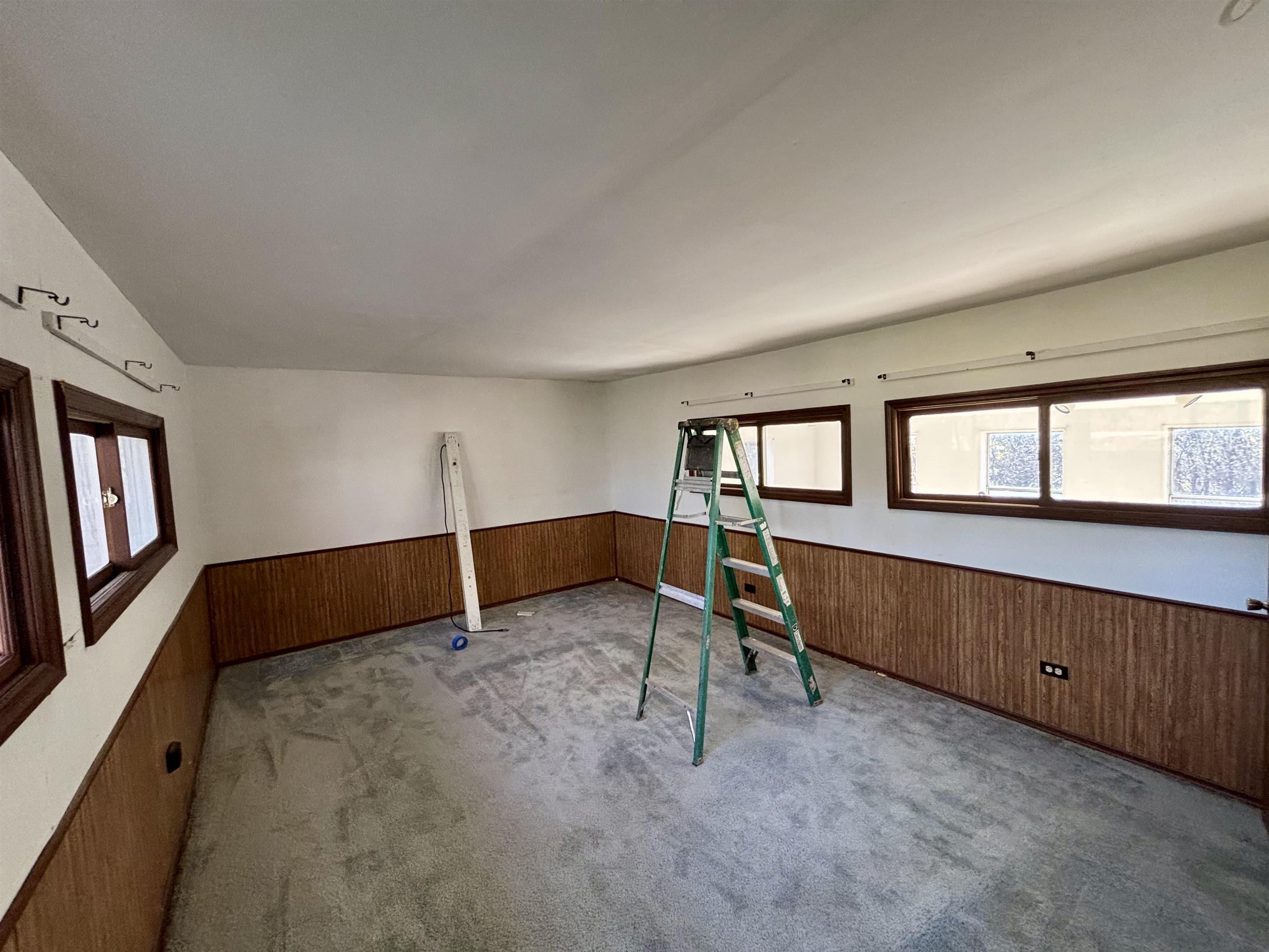 7151 West Blackjack Road Galena, IL 61036 - Photo 42 of 49 a view of an empty room with window and stairs