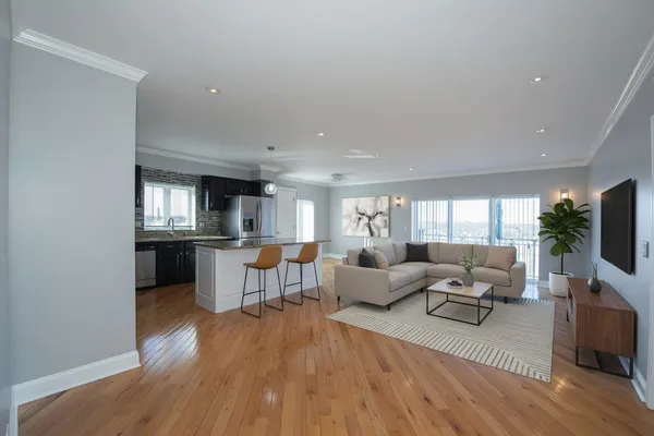 a living room with fireplace furniture and a flat screen tv