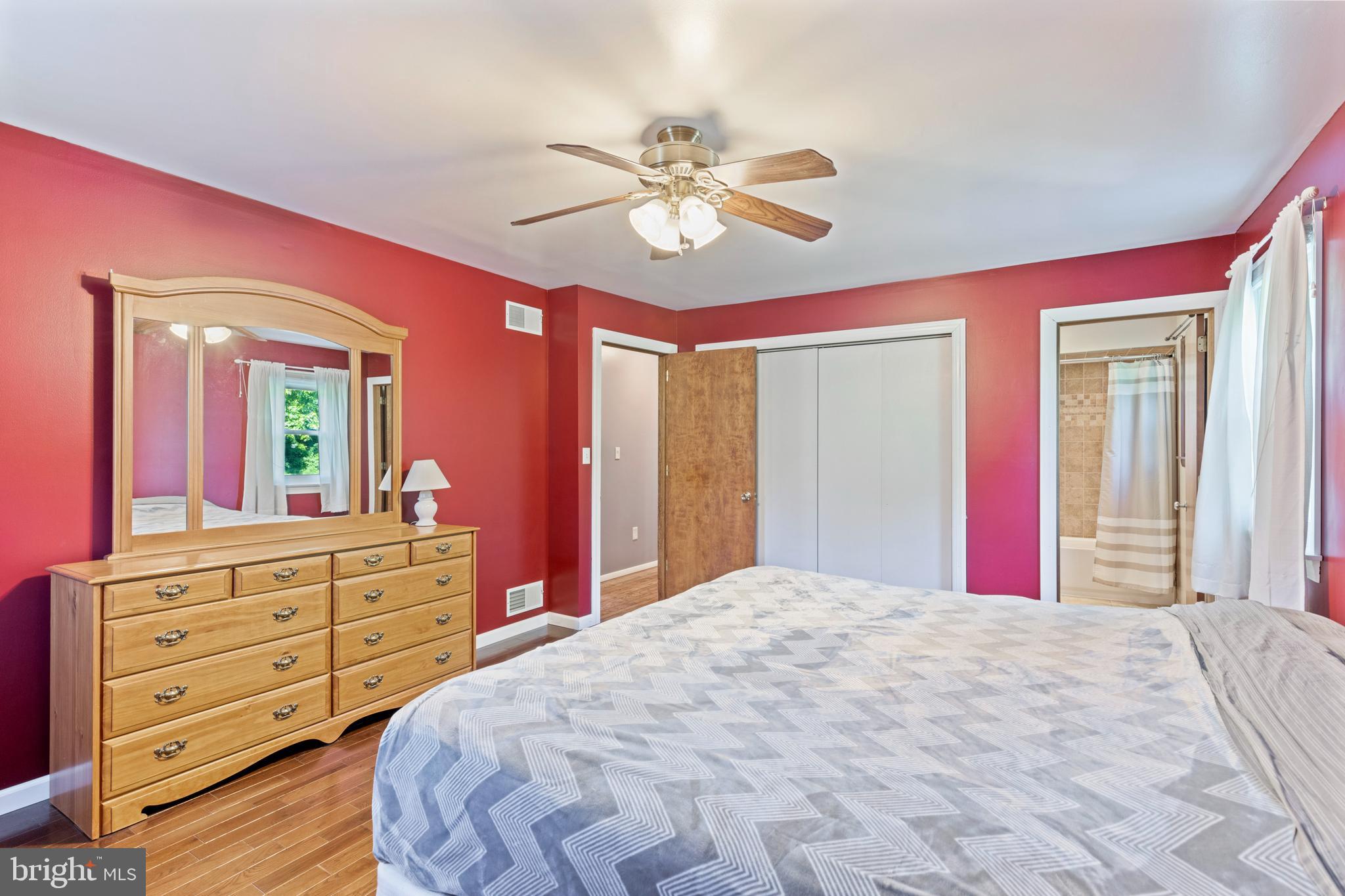 4067 East Texas Road Allentown, PA 18103 - Photo 14 of 37 a bedroom with a bed and a dresser