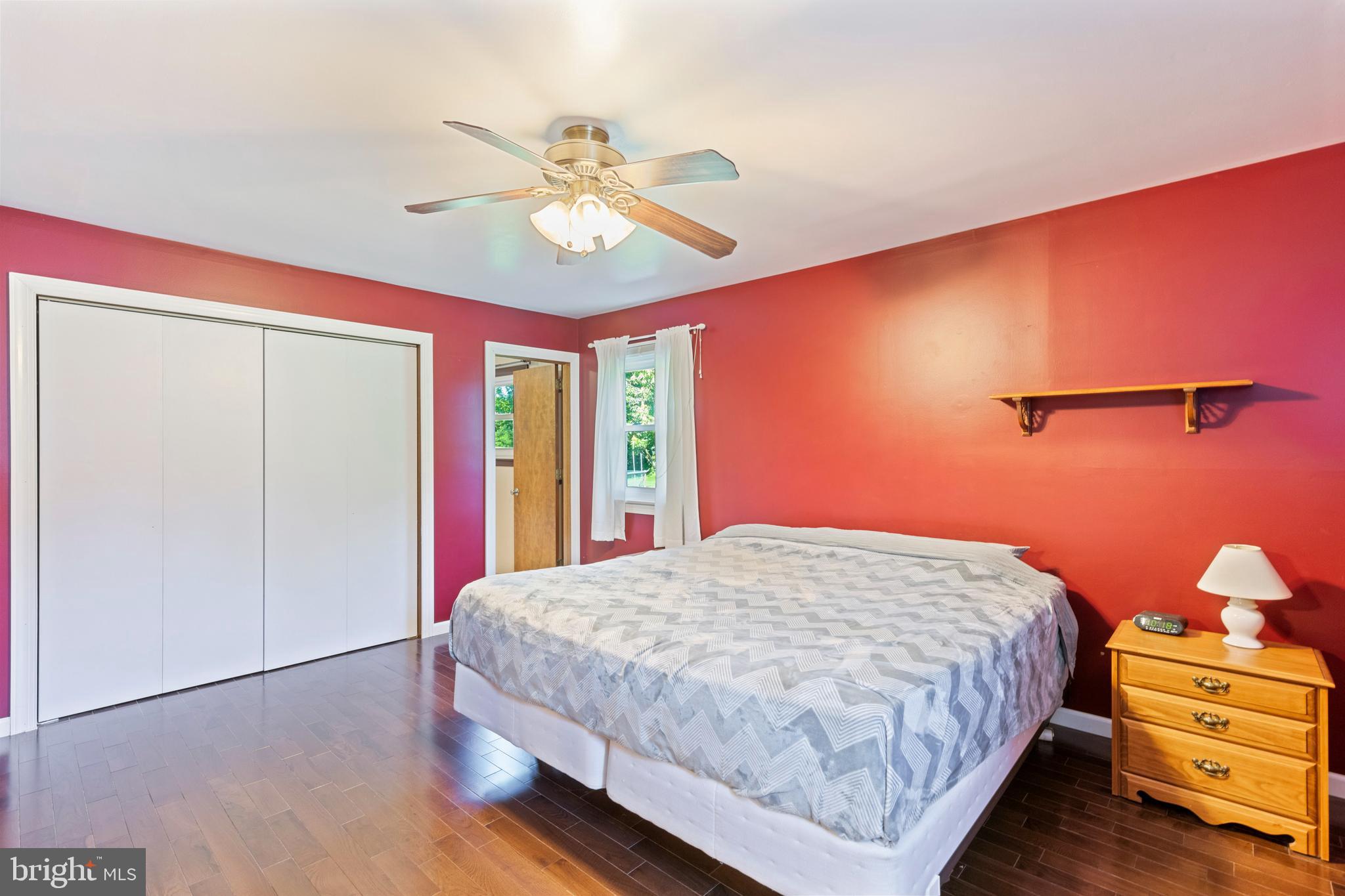 4067 East Texas Road Allentown, PA 18103 - Photo 15 of 37 a bedroom with a bed and a chandelier