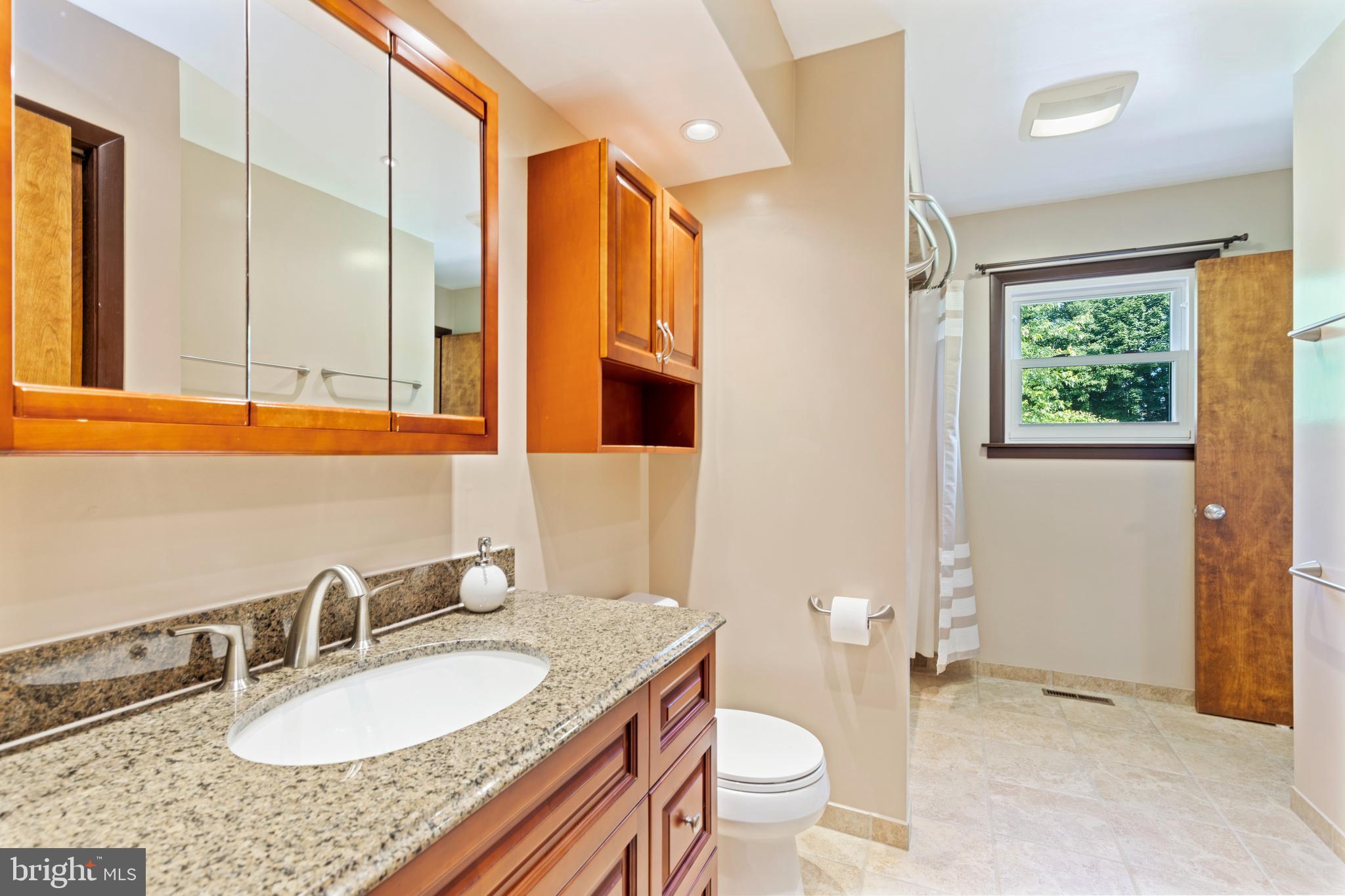 4067 East Texas Road Allentown, PA 18103 - Photo 16 of 37 a bathroom with a granite countertop sink and a mirror