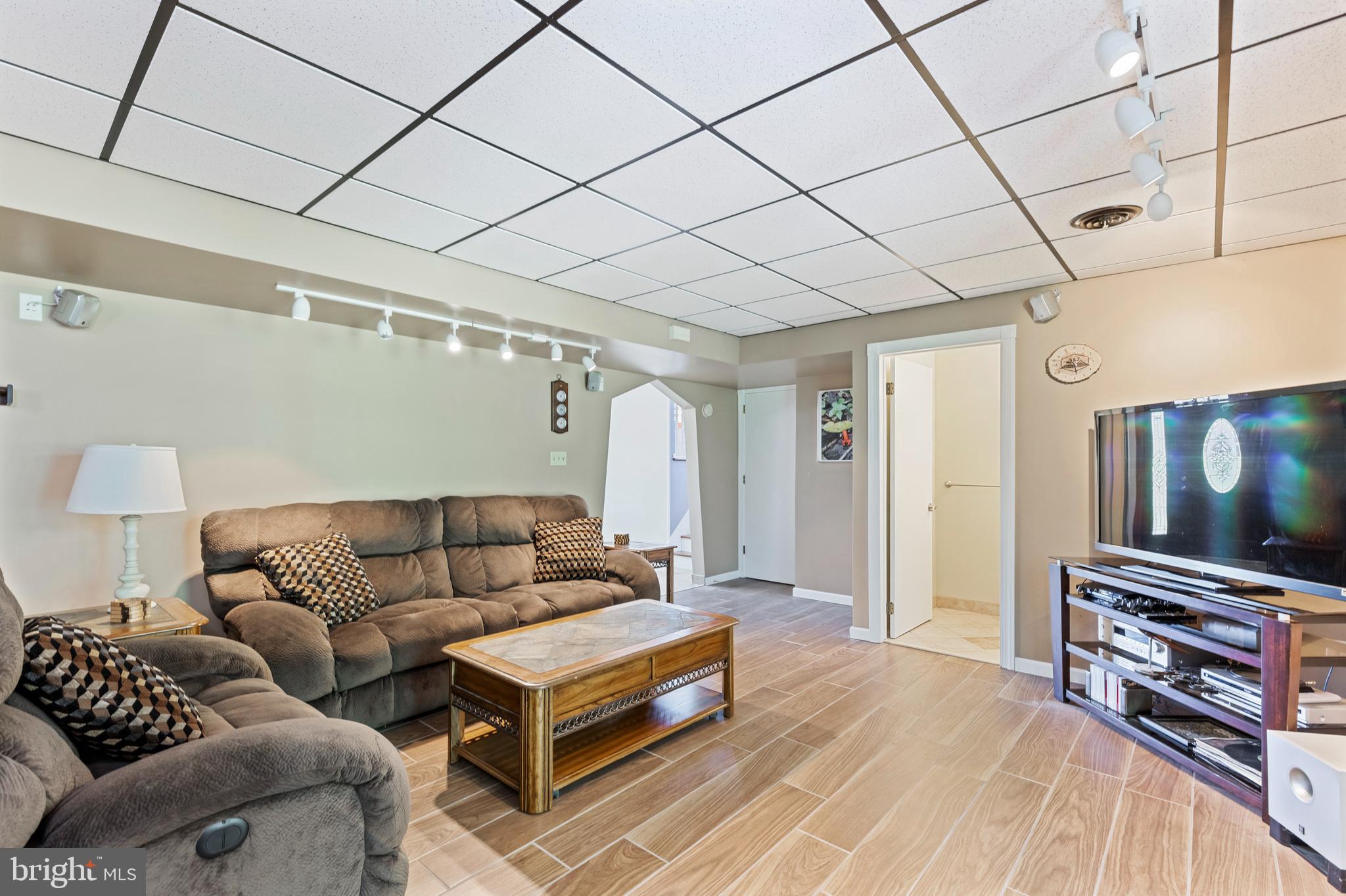 4067 East Texas Road Allentown, PA 18103 - Photo 22 of 37 a living room with furniture and a flat screen tv