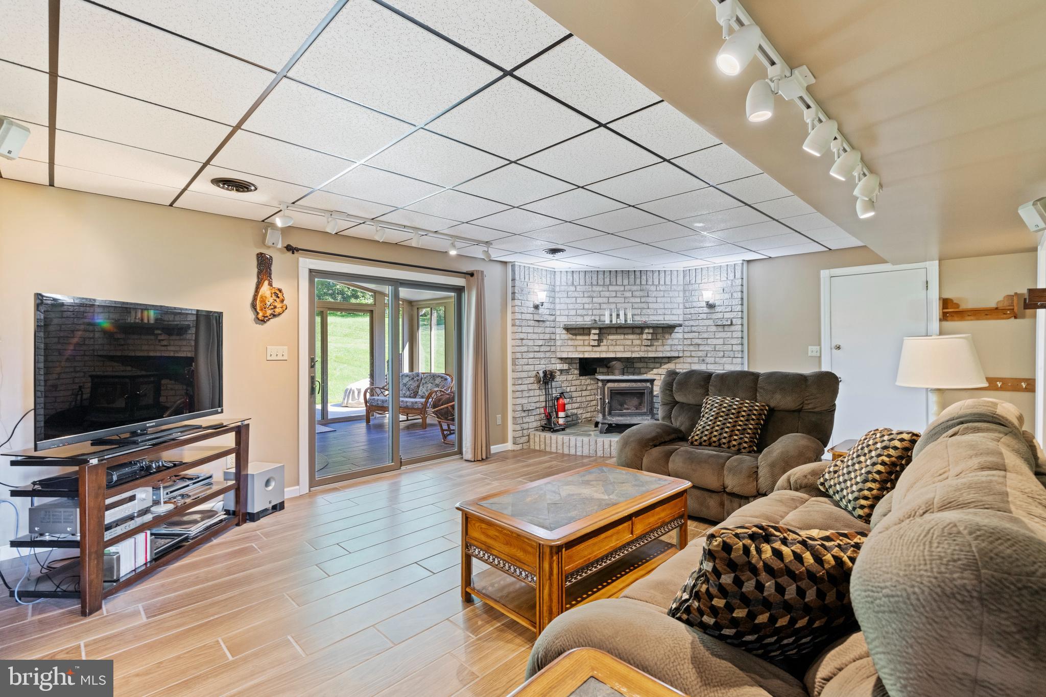 4067 East Texas Road Allentown, PA 18103 - Photo 24 of 37 a living room with furniture and a flat screen tv