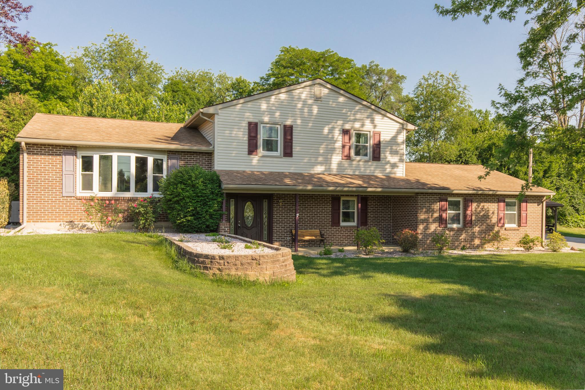 4067 East Texas Road Allentown, PA 18103 - Photo 32 of 37 a front view of house with yard and trees in the background