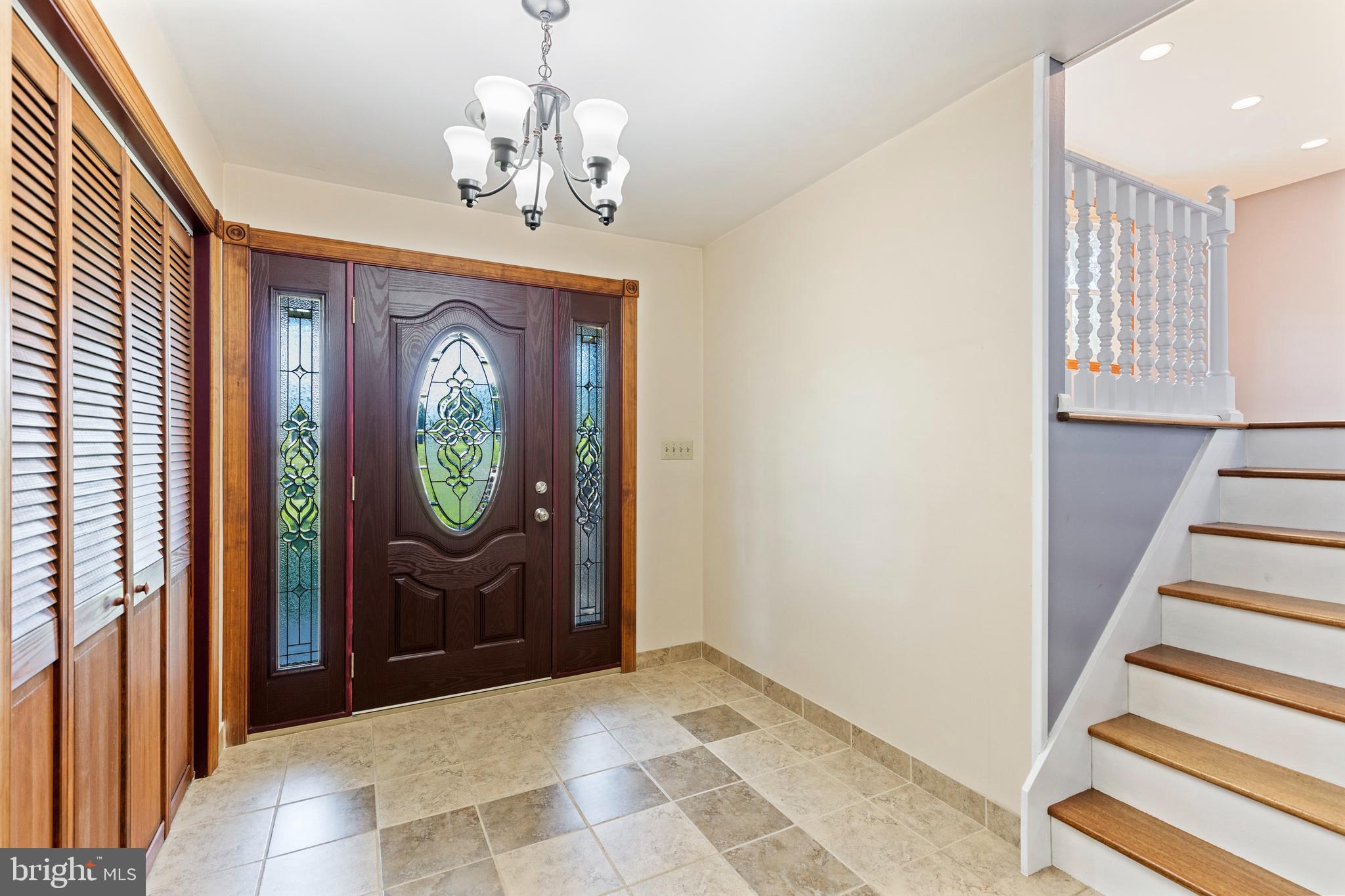 4067 East Texas Road Allentown, PA 18103 - Photo 5 of 37 a view of a hallway with wooden floor and staircase