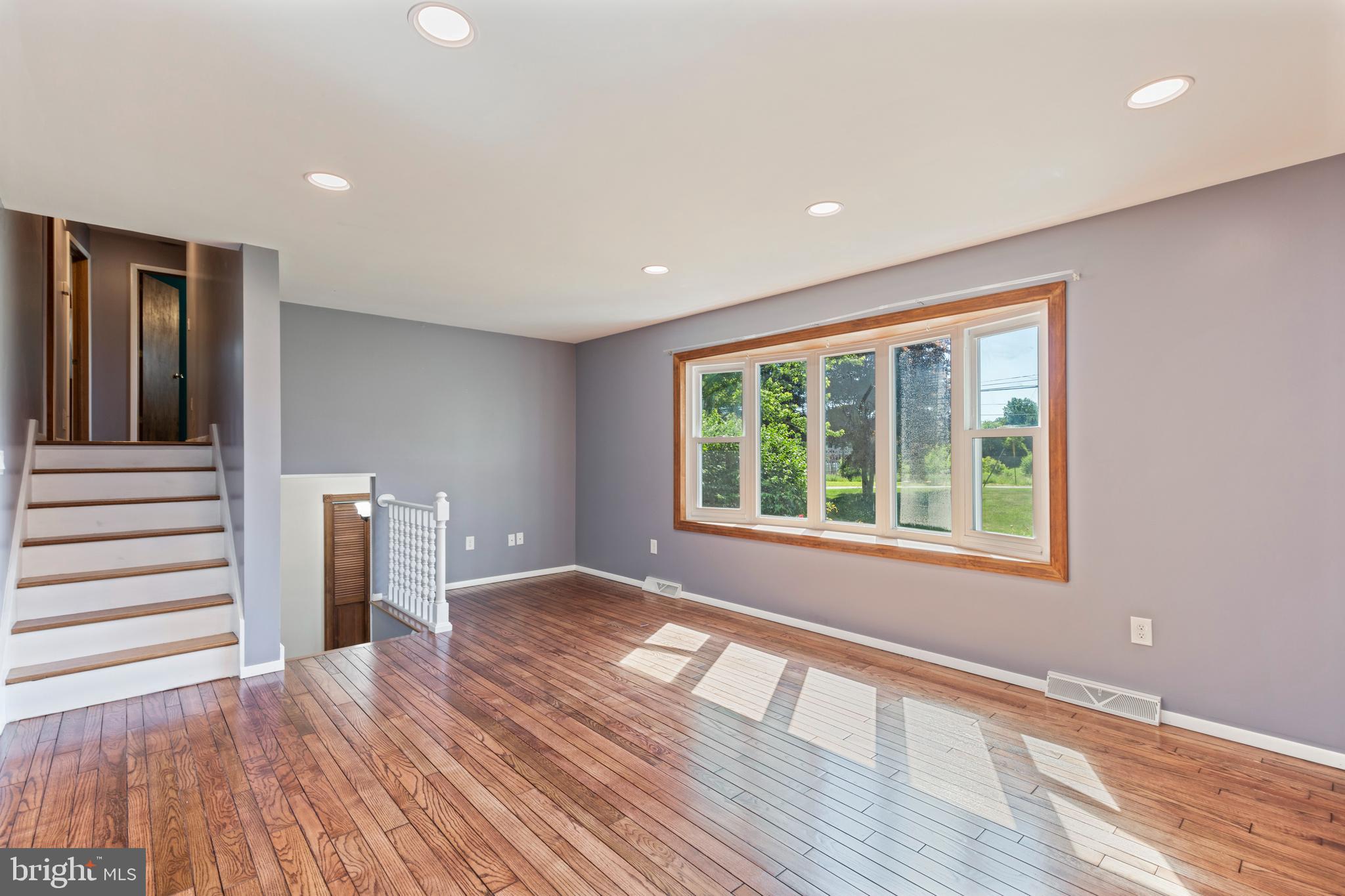 4067 East Texas Road Allentown, PA 18103 - Photo 6 of 37 a view of an empty room with wooden floor and a window