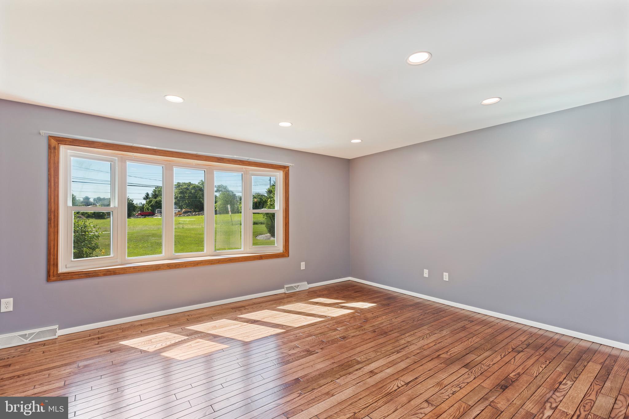 4067 East Texas Road Allentown, PA 18103 - Photo 7 of 37 a view of empty room with wooden floor and fan