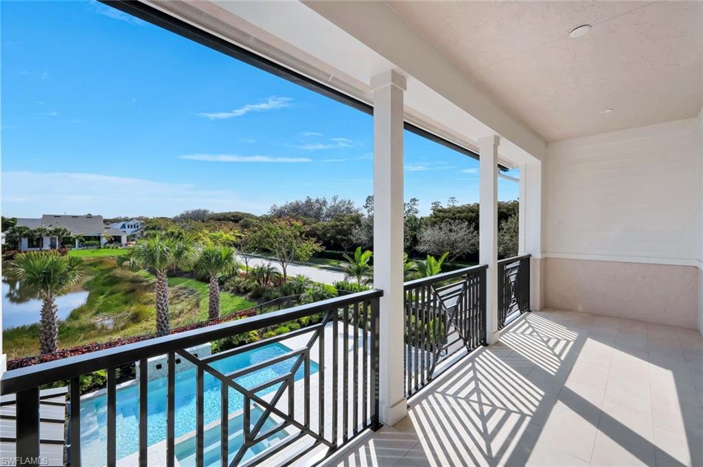 16728 Enclave Circle Naples, FL 34110 - Photo 29 of 49 Balcony with view of pool area