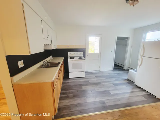 a utility room with washer and dryer