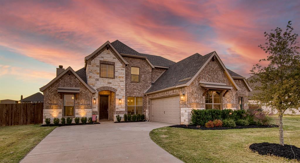 12605 Eagles Bluff Godley, TX 76044 - Photo 2 of 39 a front view of a house with a yard
