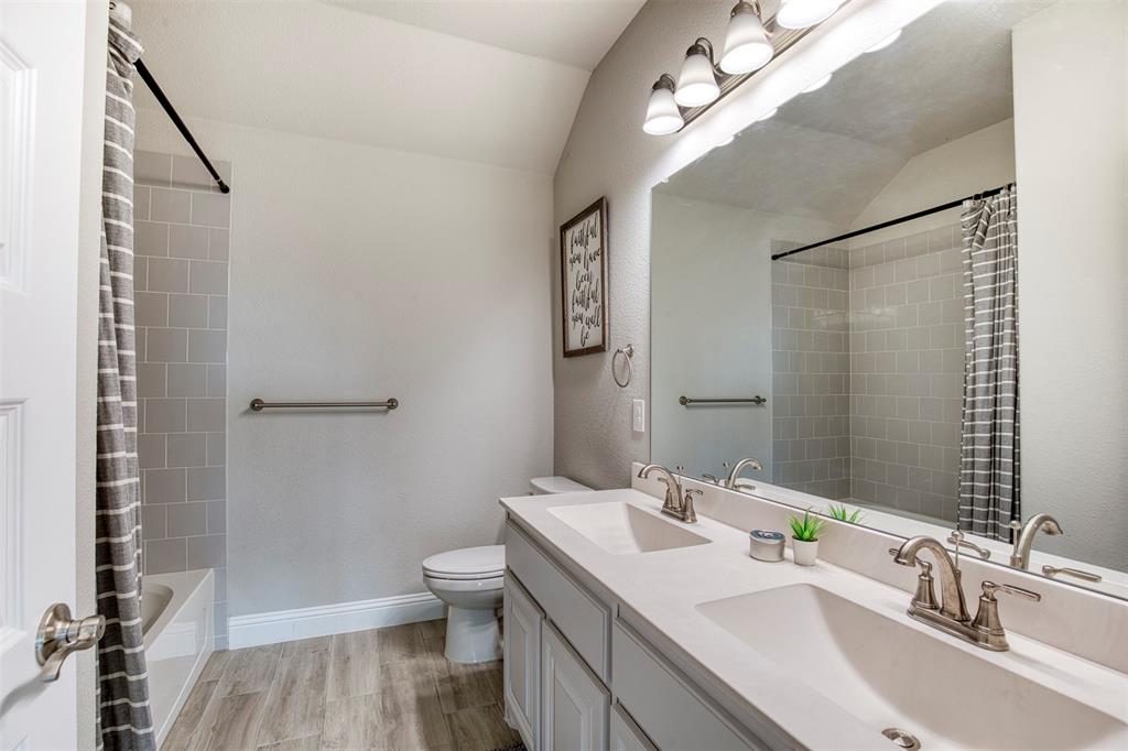 12605 Eagles Bluff Godley, TX 76044 - Photo 23 of 39 a bathroom with a sink a toilet and shower