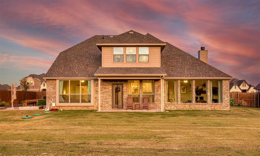 12605 Eagles Bluff Godley, TX 76044 - Photo 26 of 39 a front view of a house with a ocean view