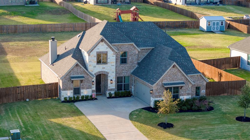 12605 Eagles Bluff Godley, TX 76044 - Photo 32 of 39 a aerial view of a house with swimming pool