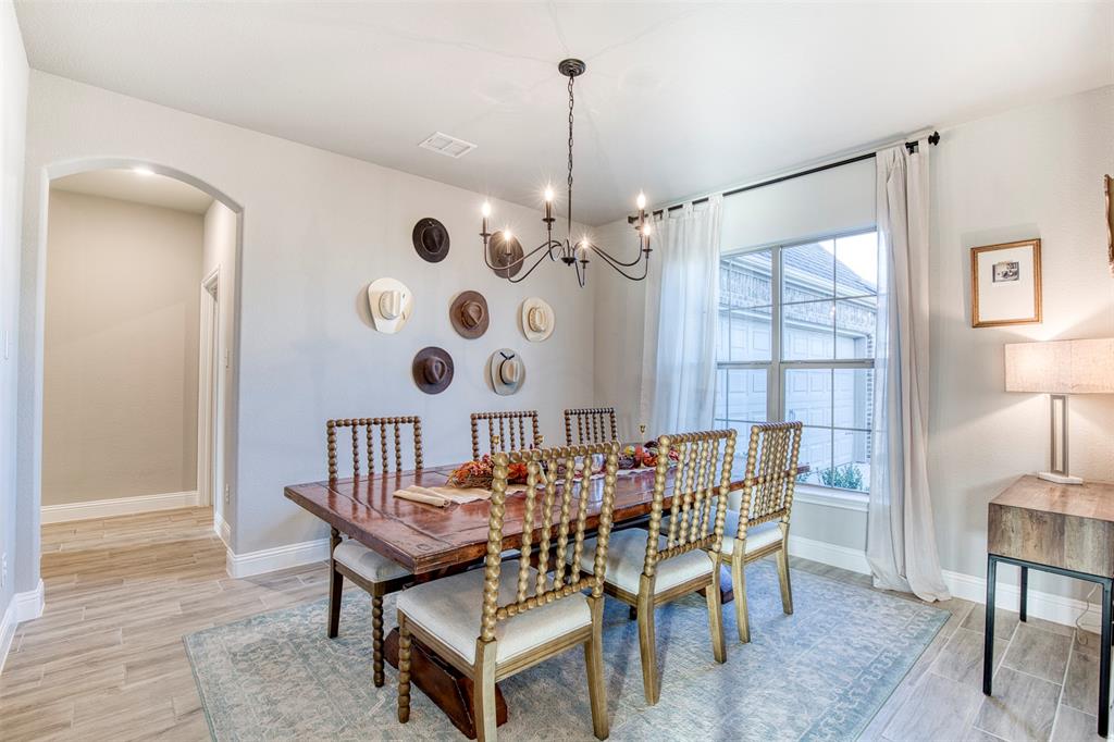 12605 Eagles Bluff Godley, TX 76044 - Photo 4 of 39 a view of a dining room with furniture and chandelier