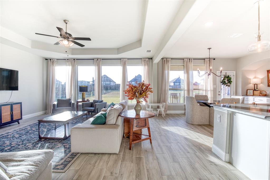 12605 Eagles Bluff Godley, TX 76044 - Photo 7 of 39 a living room with furniture and a wooden floor