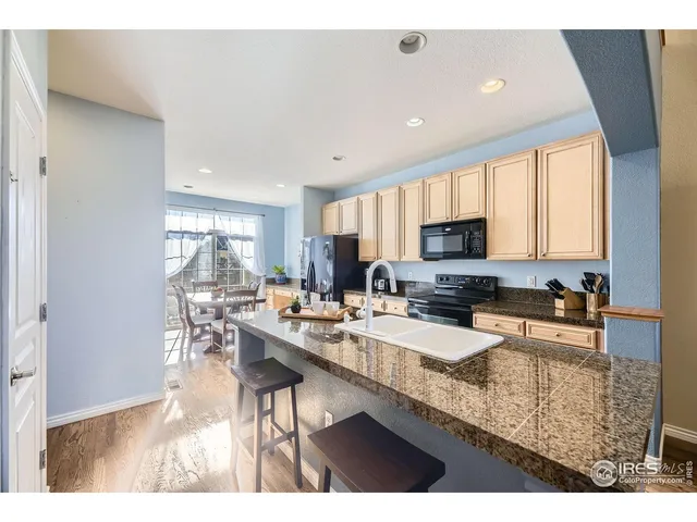 a kitchen with granite countertop lots of counter top space and furniture