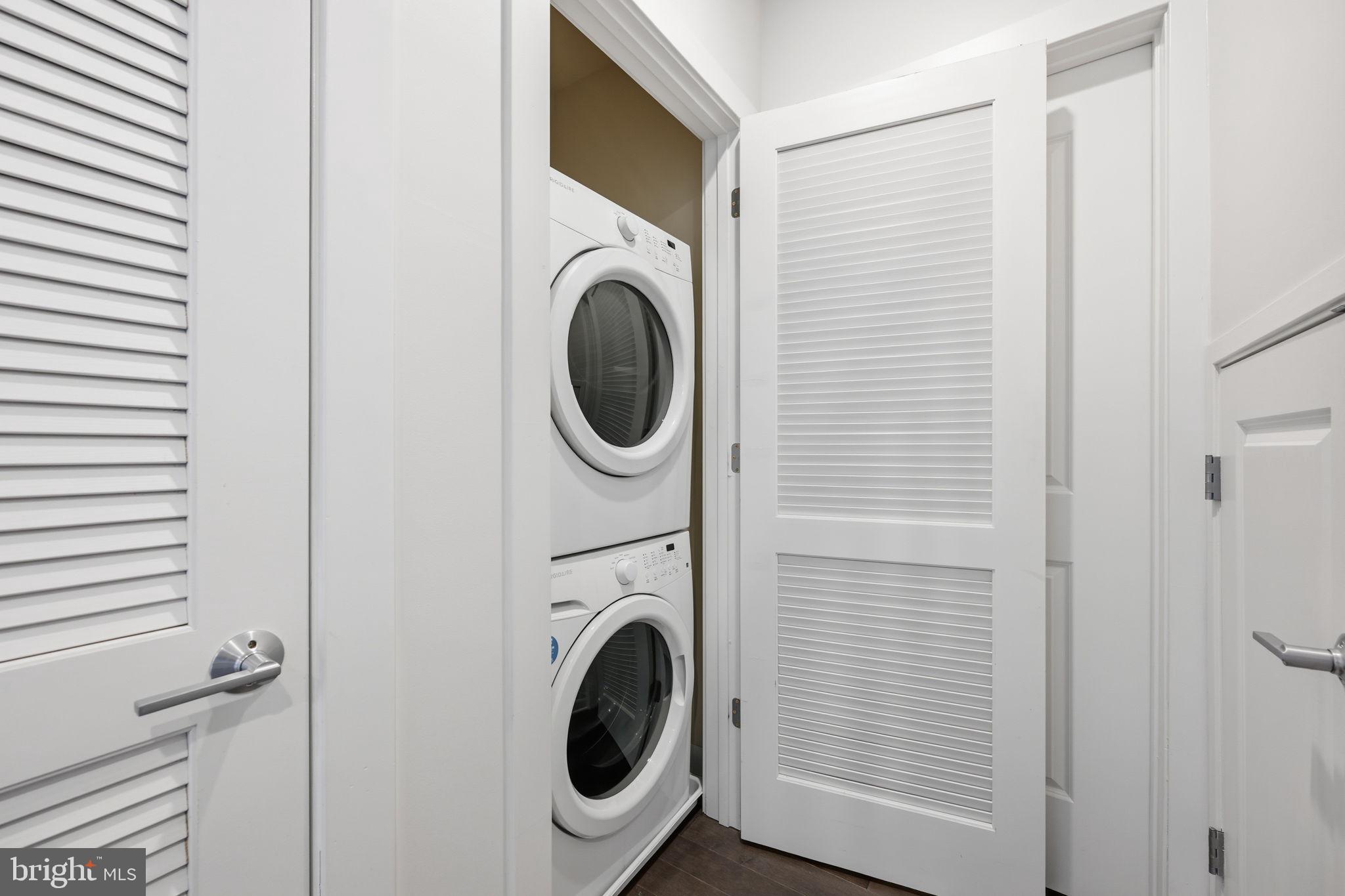 401 15th Street Southeast, Unit 401 Washington, DC 20003 - Photo 18 of 20 a view of a hallway with washer and dryer