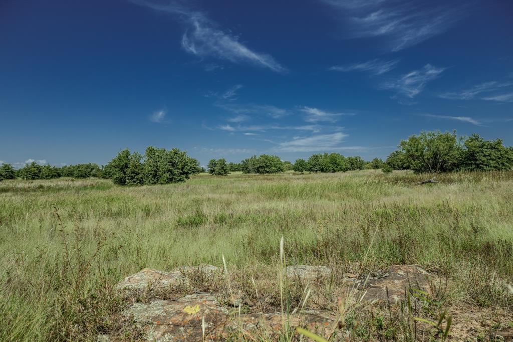 1 West Pleasant Valley Road Bellevue, TX 76228 - Photo 26 of 40 a view of a lake with a yard