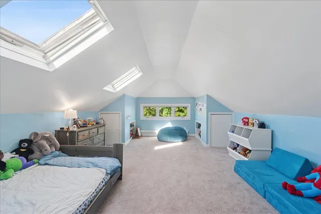 a bedroom with furniture and a chandelier