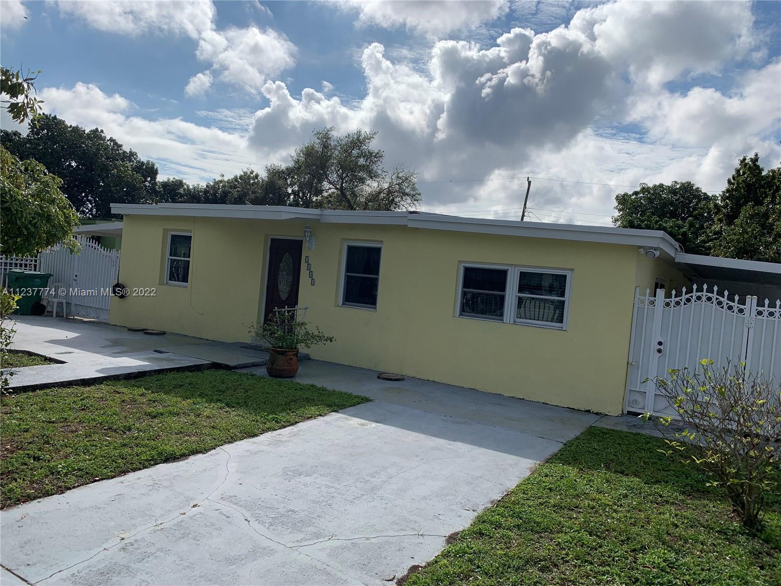 3130 Northwest 98th Street Miami, FL 33147 - Photo 2 of 23 a front view of house with yard