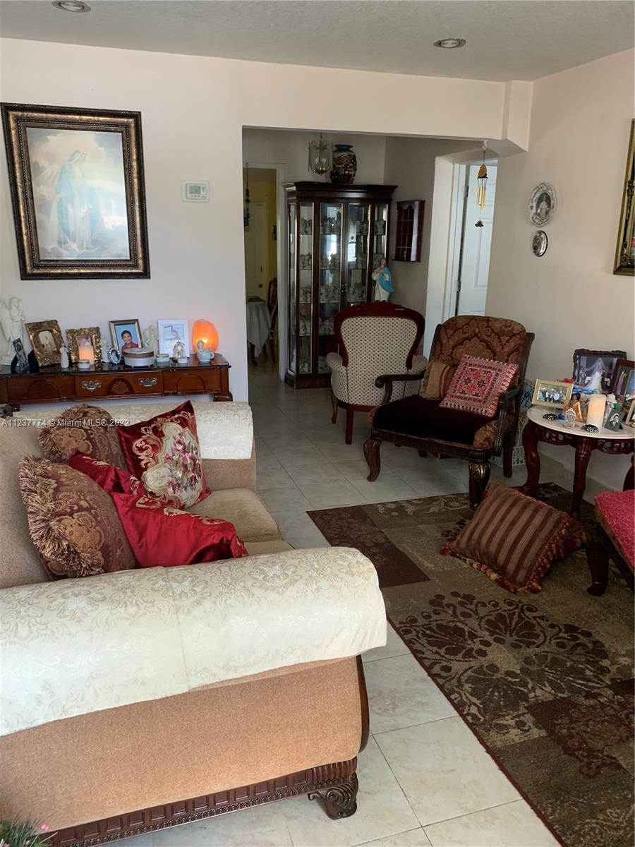 3130 Northwest 98th Street Miami, FL 33147 - Photo 3 of 23 a bedroom with furniture and wooden floor