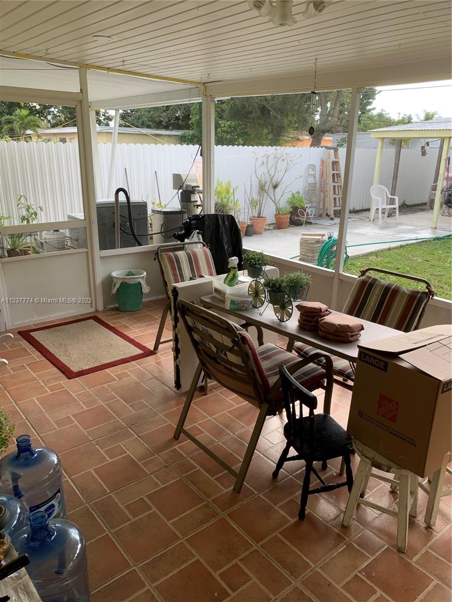 3130 Northwest 98th Street Miami, FL 33147 - Photo 10 of 23 a backyard of a house with outdoor seating