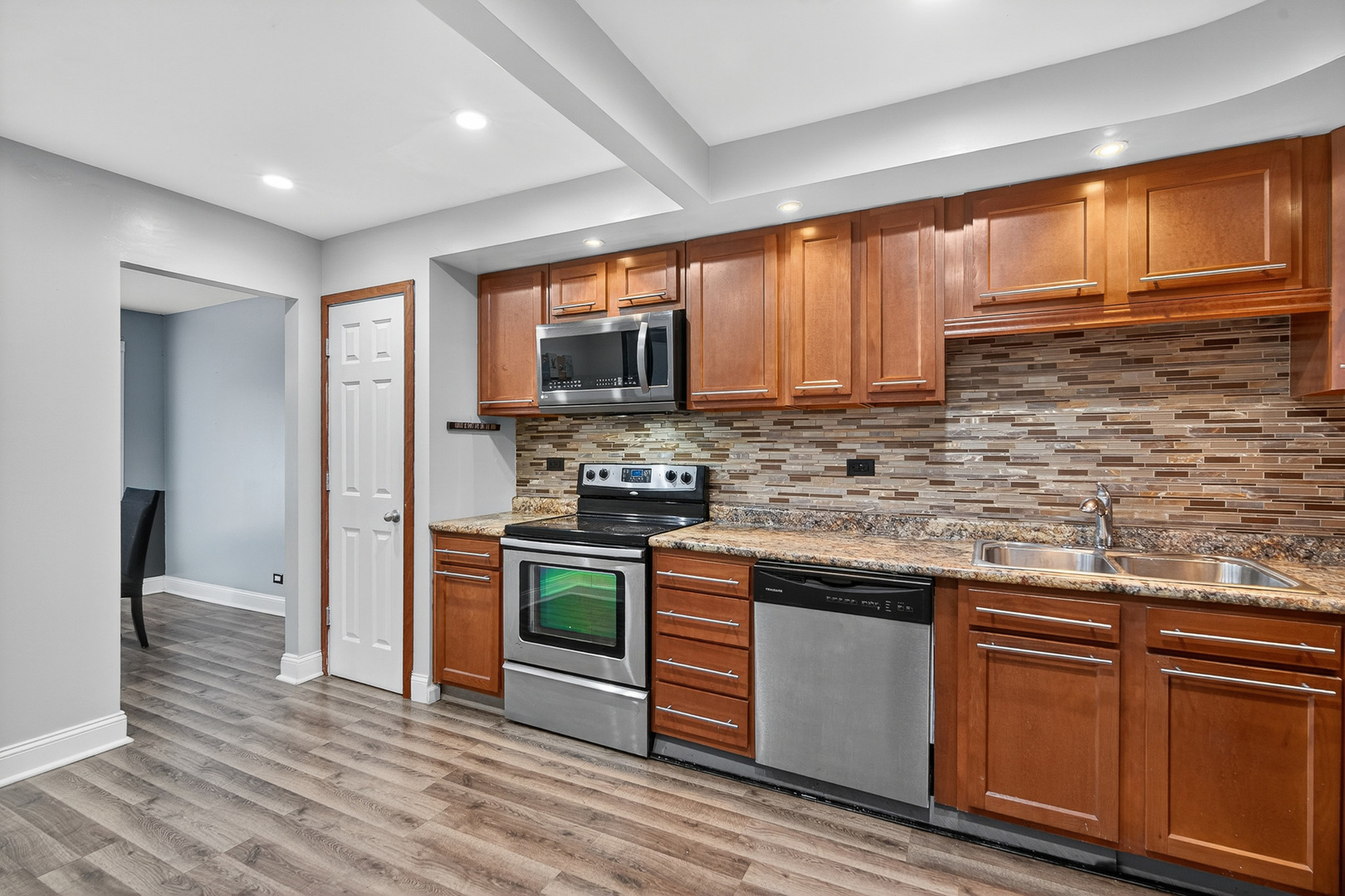 535 Jordan Way Bolingbrook, IL 60440 - Photo 15 of 35 a kitchen with stainless steel appliances granite countertop a stove a sink dishwasher and a refrigerator