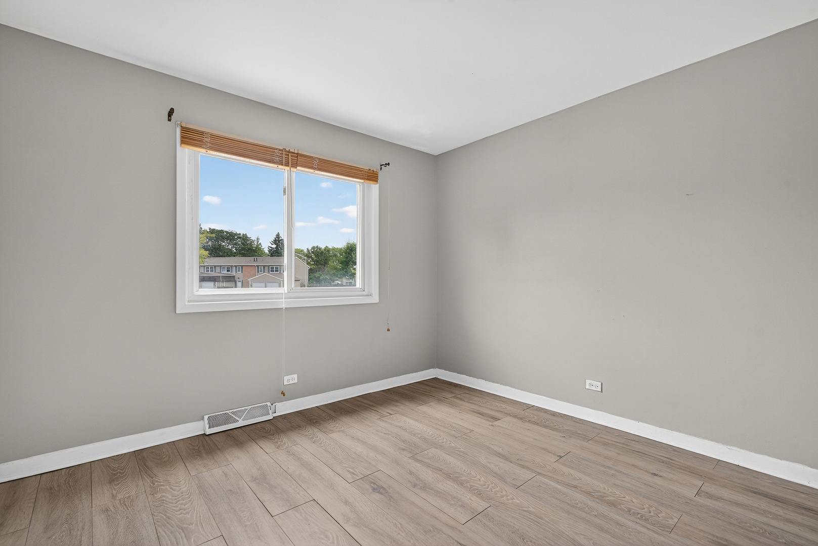 535 Jordan Way Bolingbrook, IL 60440 - Photo 16 of 35 a view of an empty room with wooden floor and a window