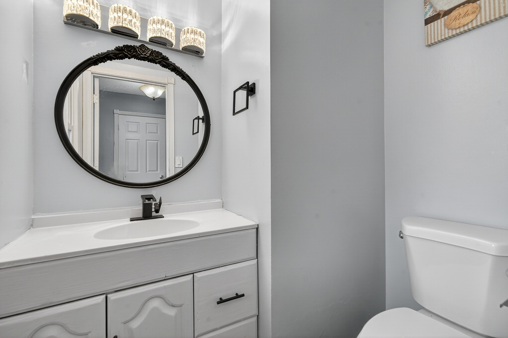 535 Jordan Way Bolingbrook, IL 60440 - Photo 5 of 35 a bathroom with a toilet a sink and a mirror