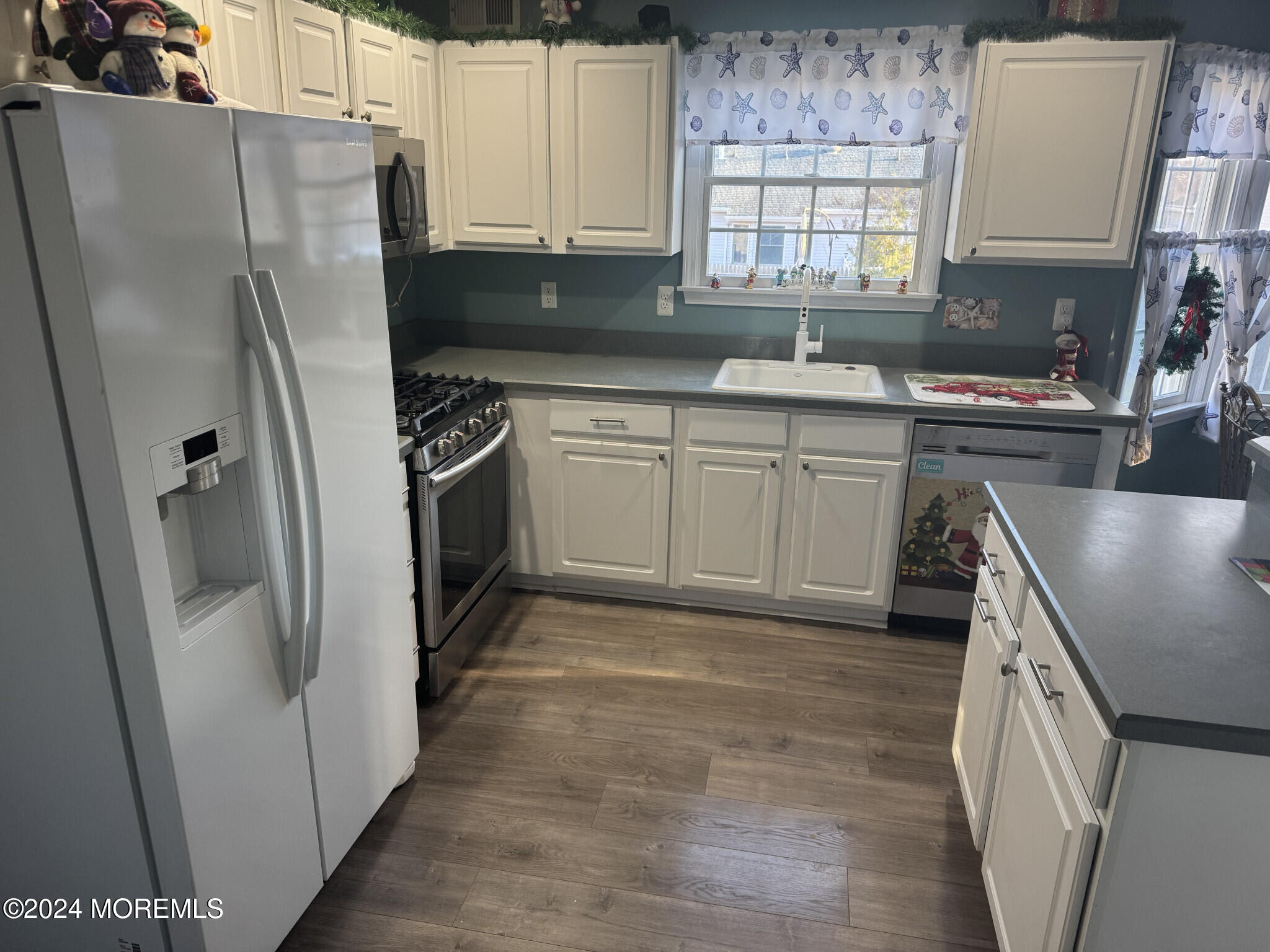 141 Marlin Road Manahawkin, NJ 08050 - Photo 12 of 33 a kitchen with stainless steel appliances granite countertop a refrigerator a sink a stove a washer and dryer