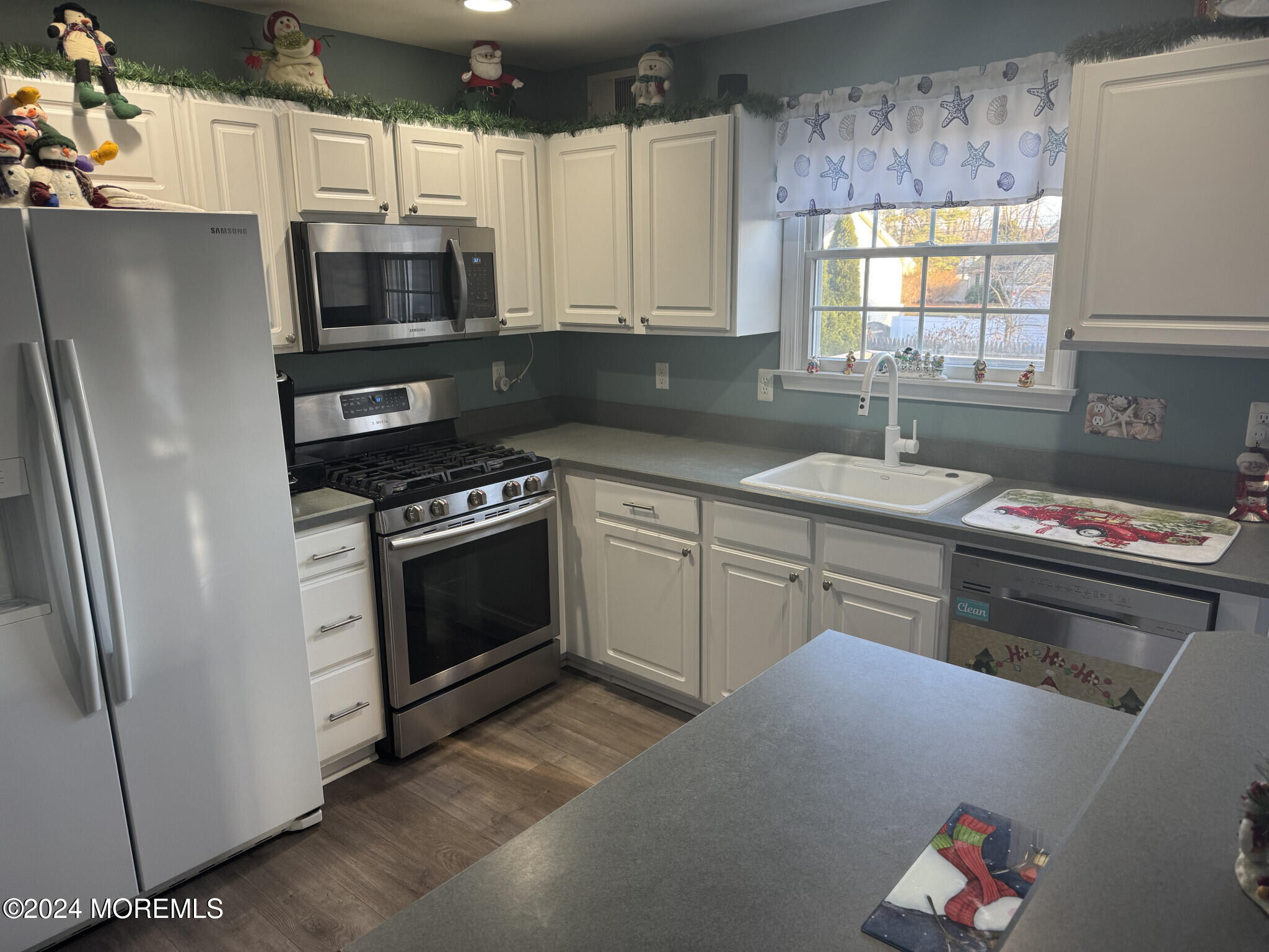 141 Marlin Road Manahawkin, NJ 08050 - Photo 13 of 33 a kitchen with a sink stove and microwave