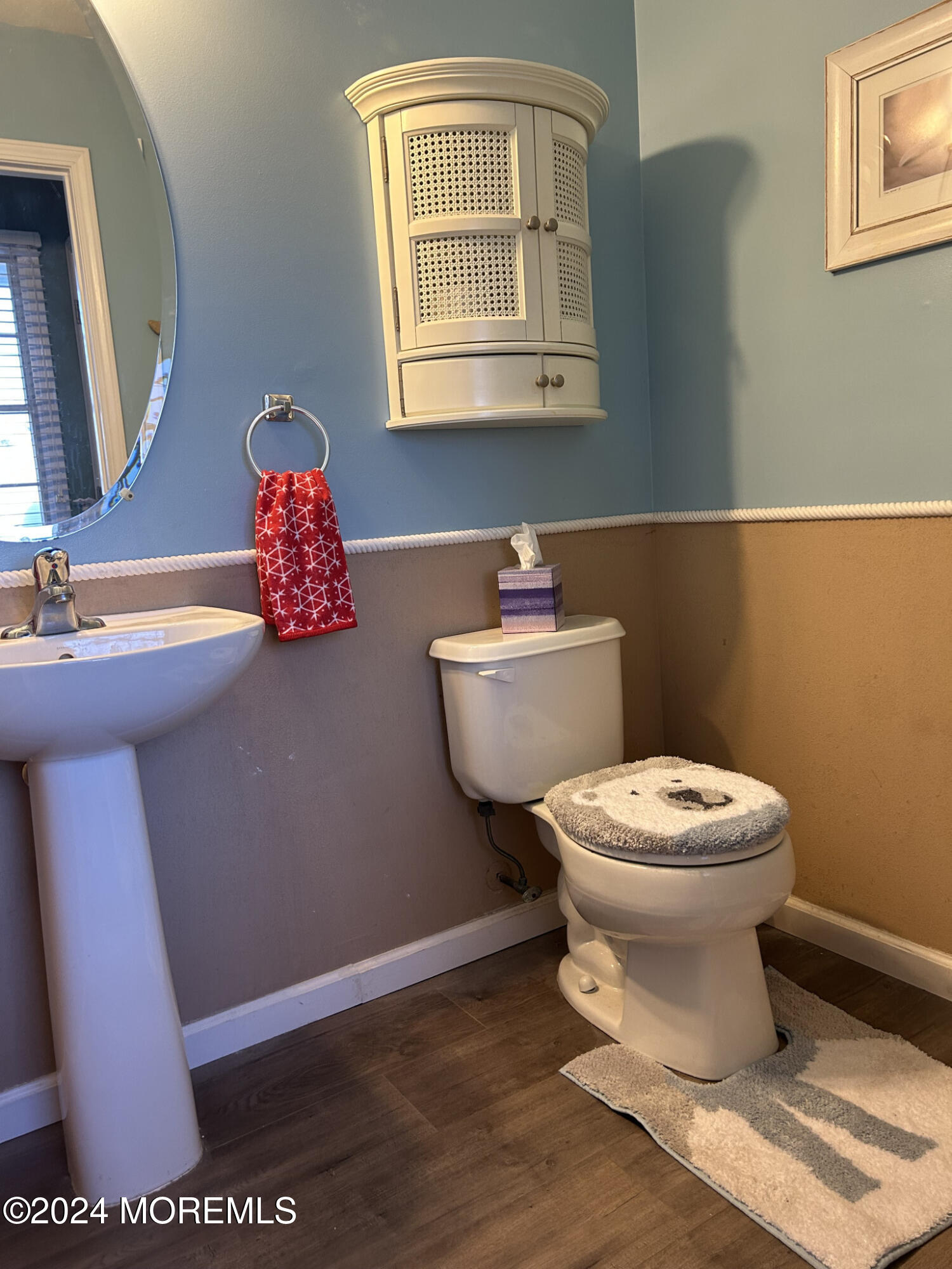 141 Marlin Road Manahawkin, NJ 08050 - Photo 19 of 33 a bathroom with a toilet a sink and a mirror